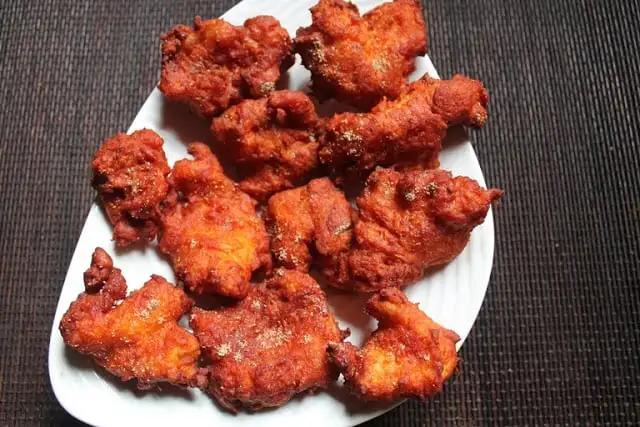 Fish Pakora fritters served on a plate at Lovely Sweets Calgary Saddletowne