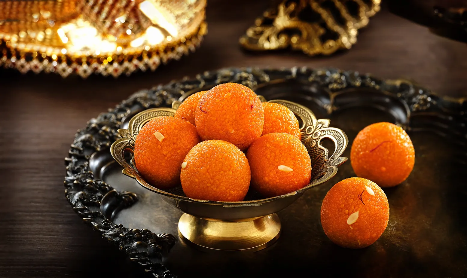 Motichoor ladoo served in a brass bowl at Lovely Sweets Calgary
