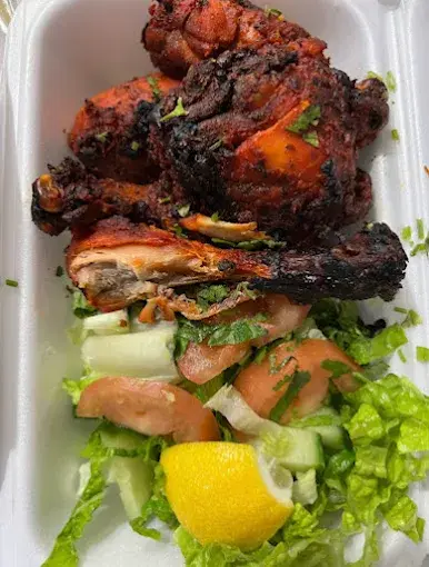 Tandoori chicken with fresh salad and lemon at Lovely Sweets Saddletowne
